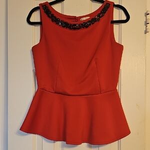 Elegant Red Peplum Top with Black Embellishments